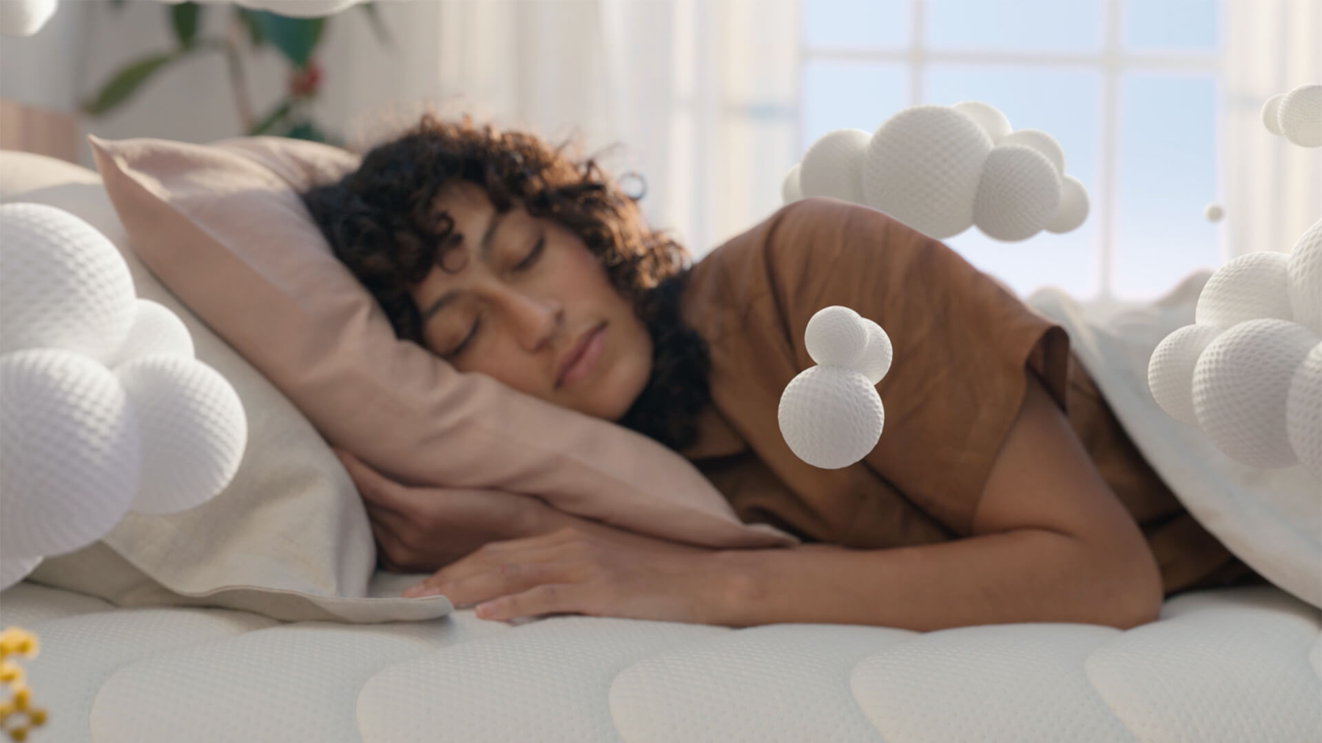 Koala Kloudcel television campaign commercial showing woman laying on bed sleeping peacefully as VFX foam clouds surround her