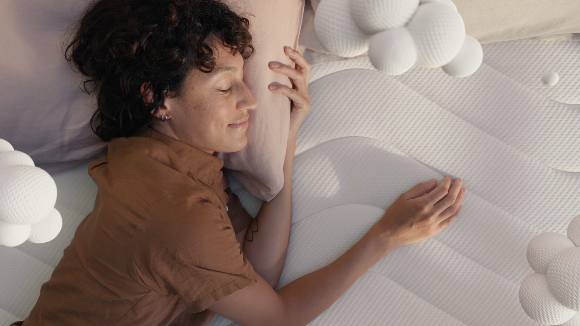 Koala Kloudcel television campaign commercial showing woman laying on bed sleeping peacefully as VFX foam clouds surround her