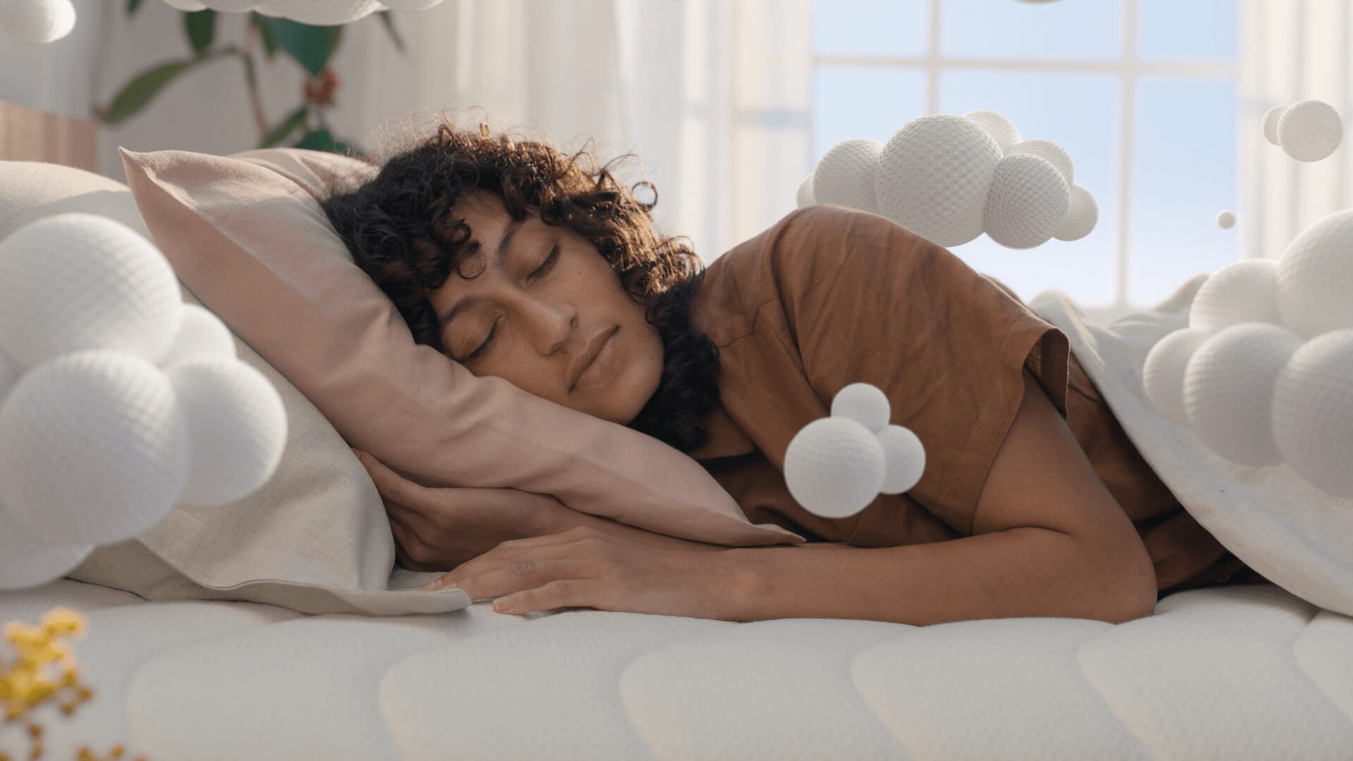 Koala Kloudcel television campaign commercial showing woman laying on bed.