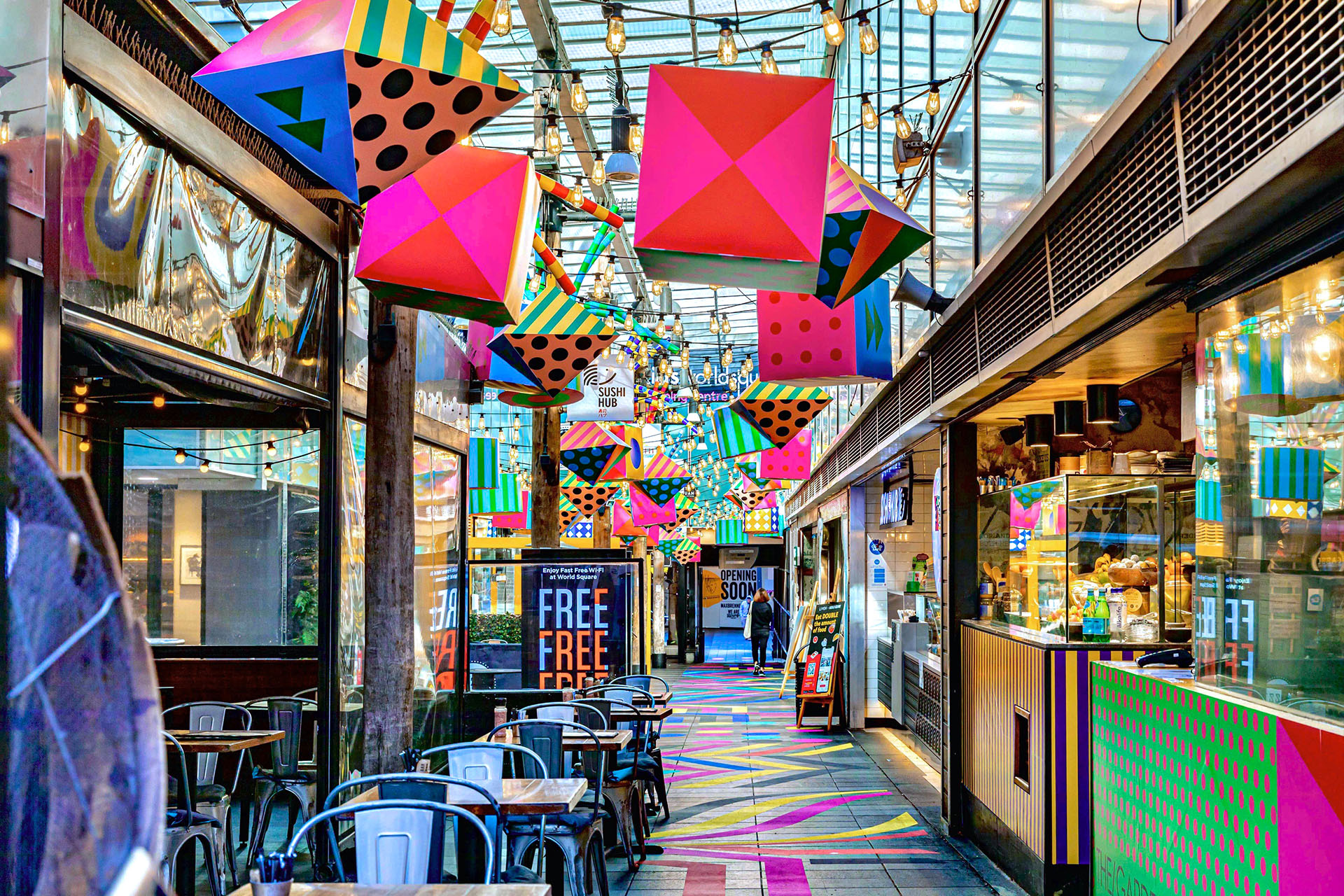 Wide shot of a multicoloured placemaking artistic mural at World Square - a World of Colour by VANDAL
