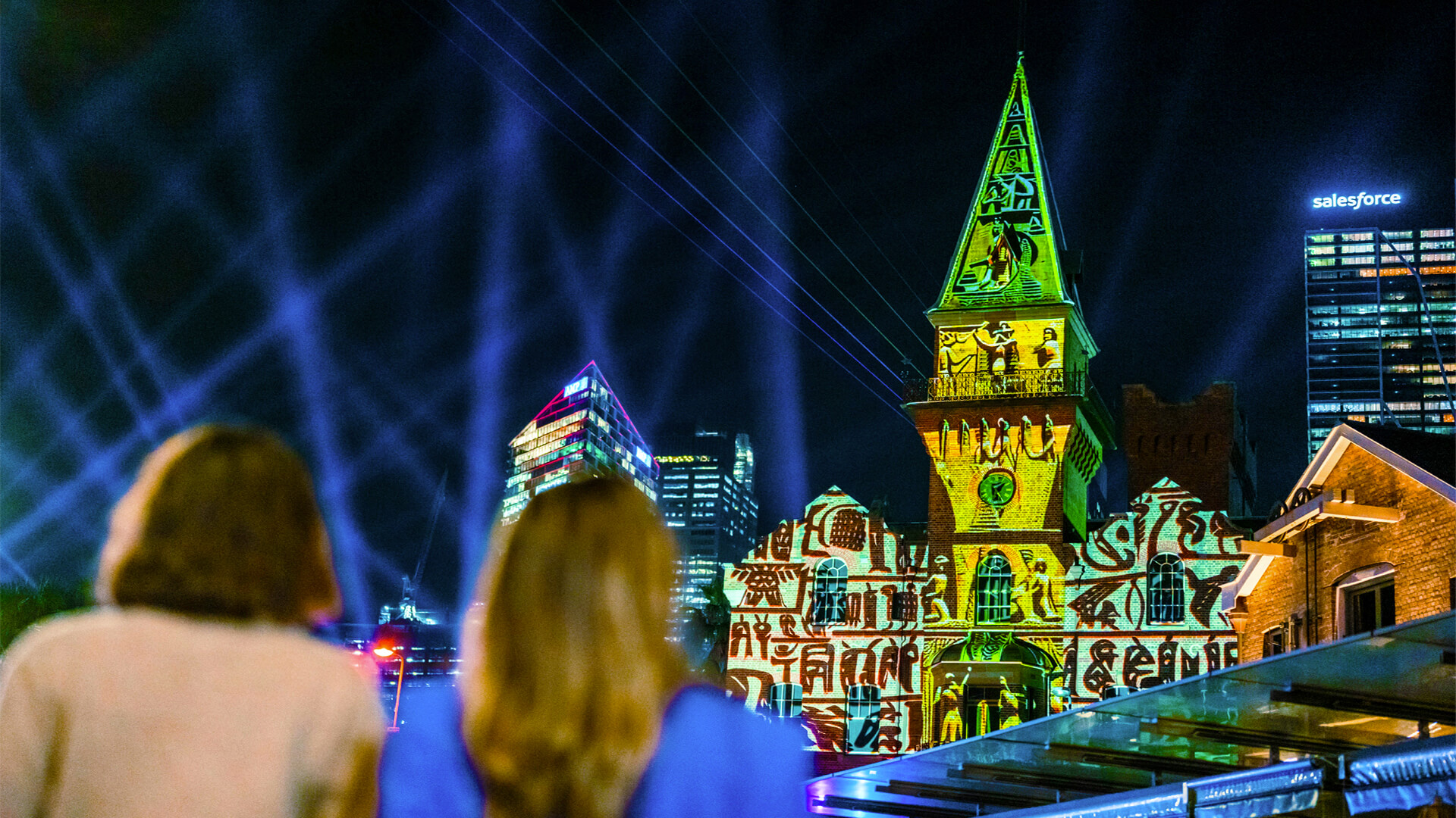 people looking at an image projection mapping colourful and bright