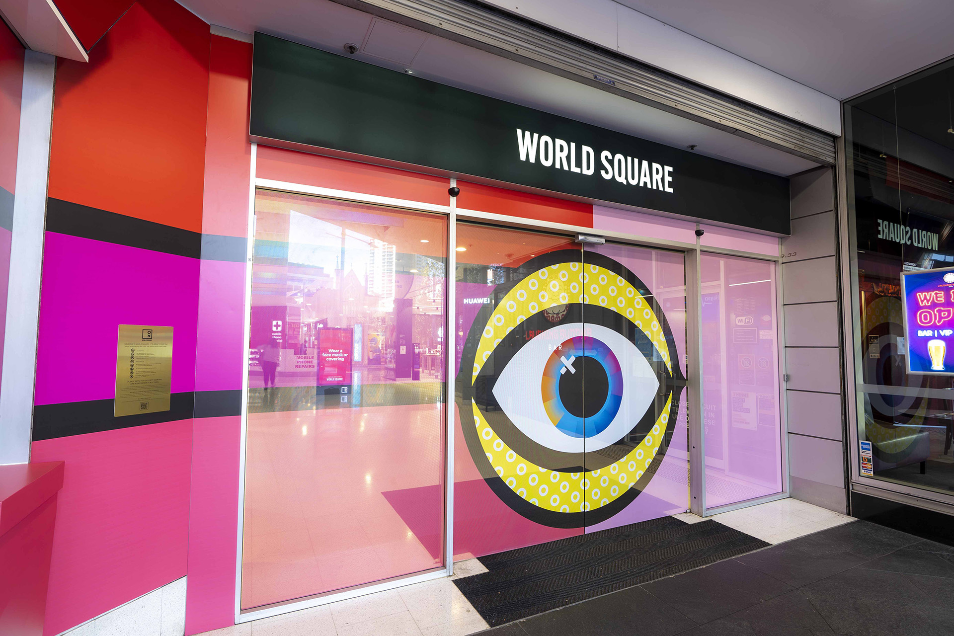 Entrance multicoloured placemaking artistic mural at World Square - a World of Colour by VANDAL